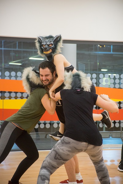 Nathan the Beast fighting off dancers as wolves