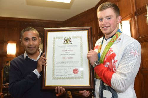 Adam Peaty with Cllr Ranjit Banwait at the reception outside the ceremonial entrance of the Council House