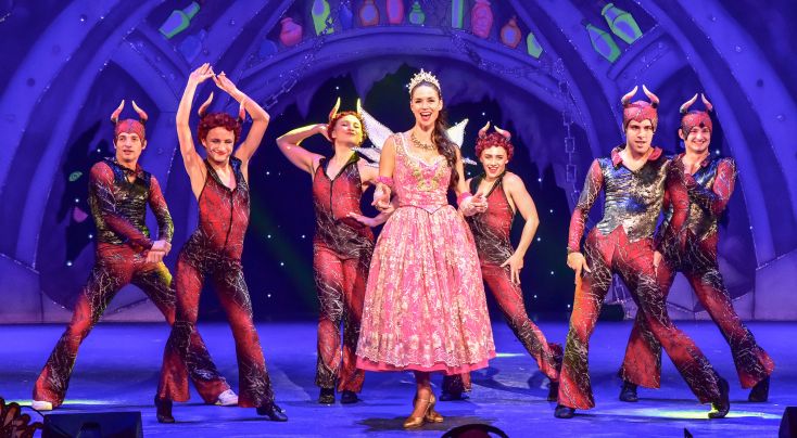 Cast from Mother Goose dance around a central figure
